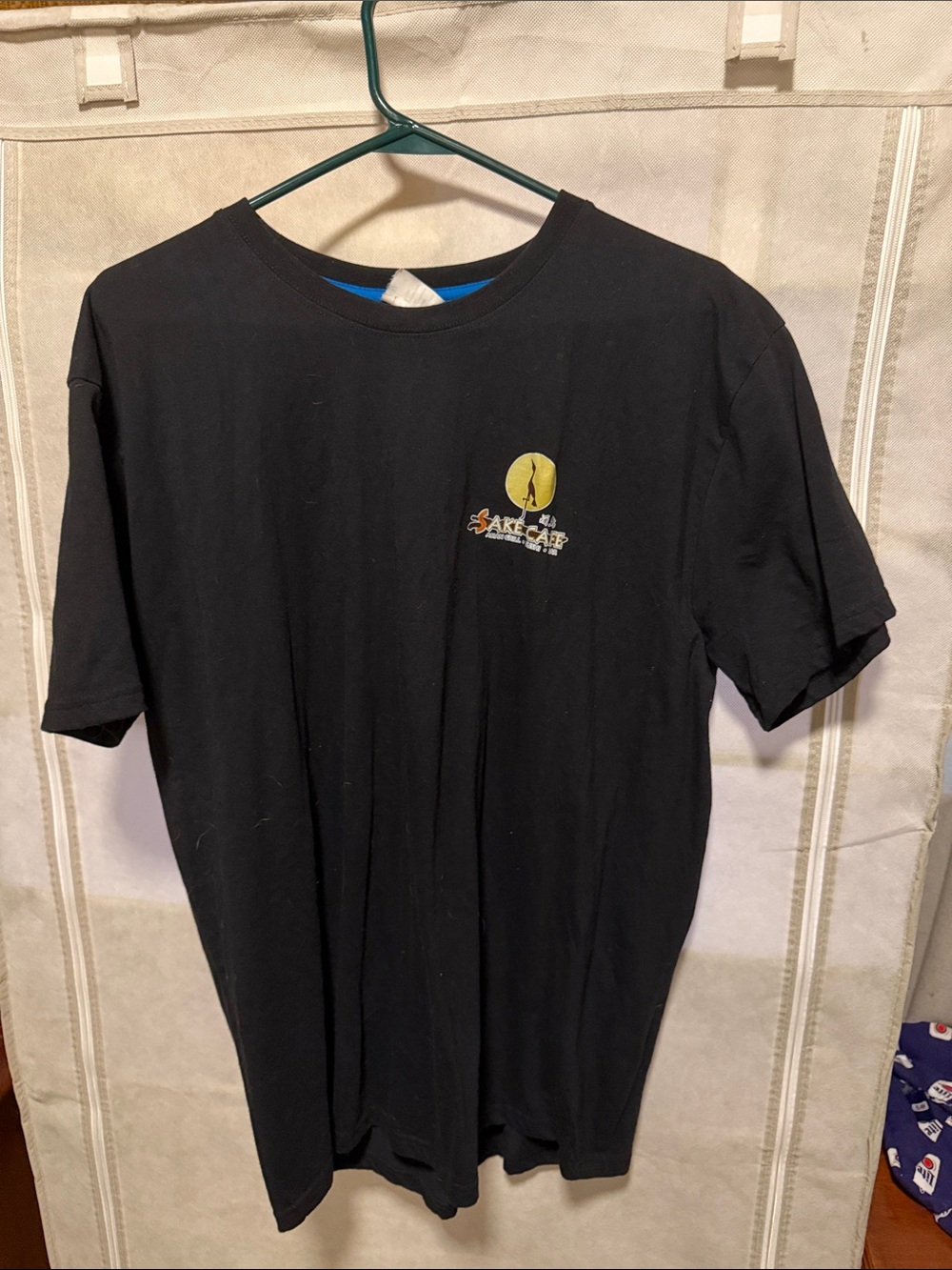 Black Short-Sleeve Graphic Tee with Small Chest Logo